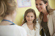 Mother and daughter with doctor in doctor's office