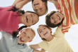 Smiling children huddling together