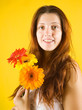 girl with flowers over yellow