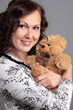 A portrait of a woman with a toy