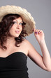 A  woman with a hat