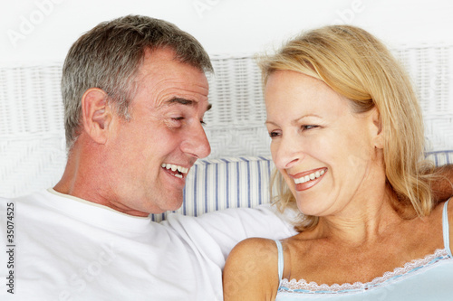 Photo: Mid age couple head and shoulders Mid age couple head and shoulders