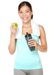 Healthy lifestyle - fitness woman eating apple