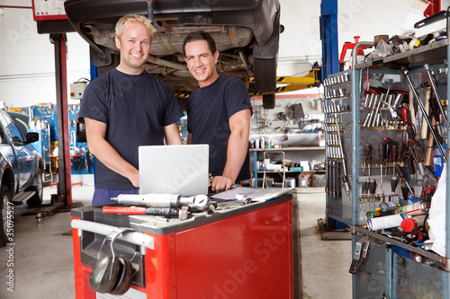 Photo: Portrait of smiling mechanics Portrait of smiling mechanics