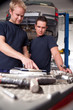 Mechanics Looking at Work Order