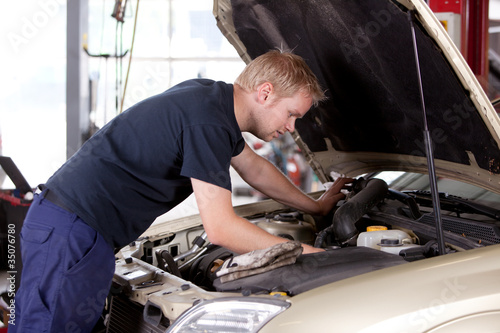 Photo: Mechanic Fixing Car Mechanic Fixing Car