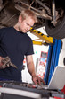 Foto: Auto Mechanic with Laptop Auto Mechanic with Laptop