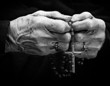 Old woman hands with a rosary