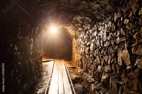 Foto: Mine tunnel with path - historical gold, silver, copper mine. Mine tunnel with path - historical gold, silver, copper mine.