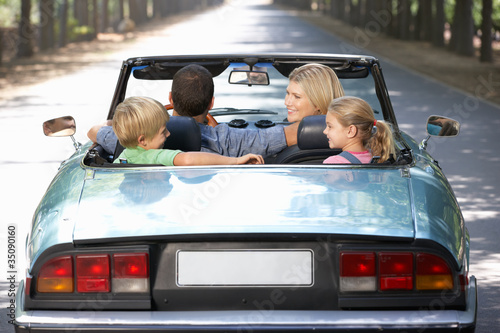Photo: family in sports car family in sports car