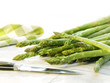 Photo: Freshly picked asparagus on white marble Freshly picked asparagus on white marble