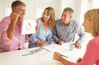 Mid age couples painting with watercolors