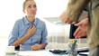 Boss giving reprimand to female worker