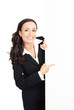Businesswoman showing blank signboard, on white