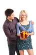 A romantic couple holding a gift