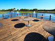 Cafe on the artificial pond with fountain. Cafe on the artificial pond with fountain.
