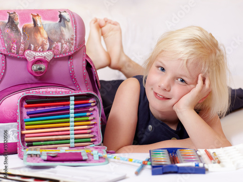Foto: Cute blond child is proud to start at school Cute blond child is proud to start at school