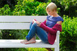 woman reading book in park