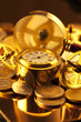 gold watches, coins, gears and magnifying glass