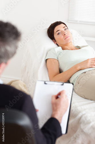 Photo: Psychologist talking to a sad female patient Psychologist talking to a sad female patient