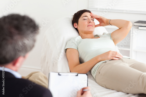 Photo: Psychologist talking to a depressed patient Psychologist talking to a depressed patient