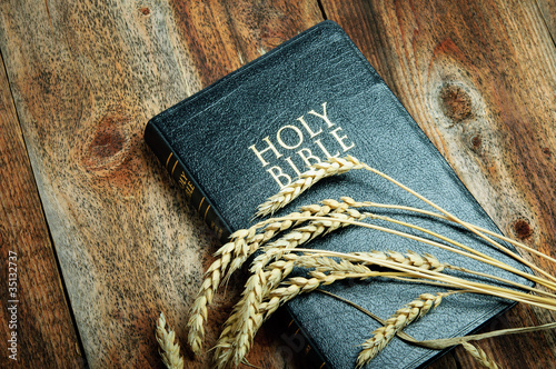 Photo: Bible and Wheat on Wood background Bible and Wheat on Wood background