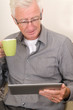 Senior working on a tablet pc