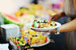 womanl chooses tasty meal in buffet at hotel womanl chooses tasty meal in buffet at hotel