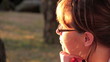 Woman looking ahead and away at sunset.