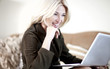 Beautiful Blond Young Woman Working On Her Laptop Computer