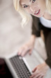 Beautiful Blond Young Woman Working On Her Laptop Computer