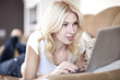 Beautiful Blond Young Woman Working On Her Laptop Computer