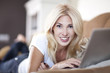 Beautiful Blond Young Woman Working On Her Laptop Computer