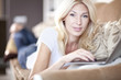 Beautiful Blond Young Woman Working On Her Laptop Computer
