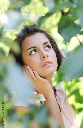 Photo: thoughtful cute girl in nature thoughtful cute girl in nature