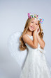 Angel children blond girl with sleeping hands gesture