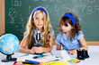 children girls at school classroom with microscope children girls at school classroom with microscope