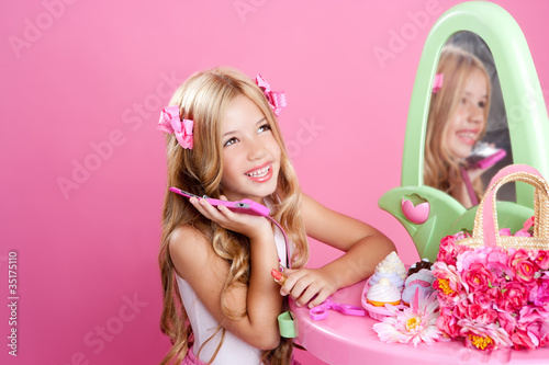 Photo: Children fashion doll blond girl talking mobile phone Children fashion doll blond girl talking mobile phone