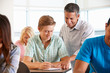 Image : Tutor helping student in class