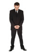 standing serious businessman in black suit, full length