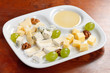 Cheese plate with grapes and honey