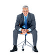 Relaxed male business executive sitting on a chair