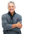 Portrait of smiling senior man with hands folded