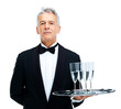 Portrait of confident waiter serving champagne