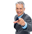Smiling mature business man pointing at you