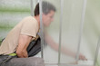 Plumber fixing shower cabin Plumber fixing shower cabin