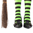 Witch's stripy legs and broomstick.