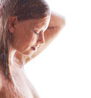 Beautiful woman bathing under shower