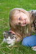 girl petting kitten