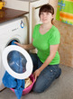 woman loading the washing machine